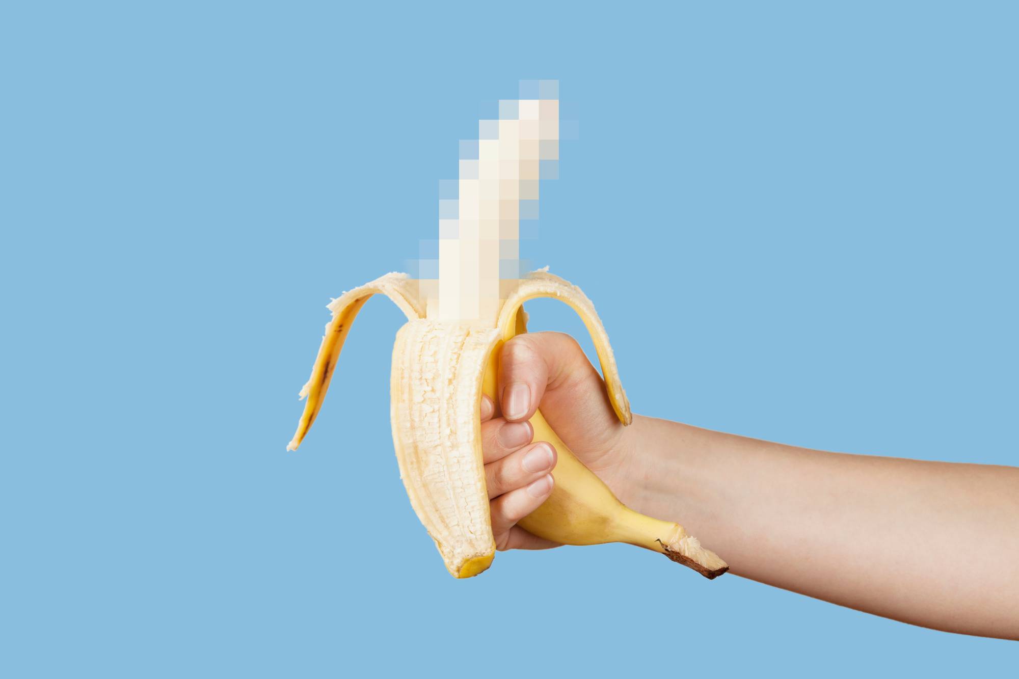 man holding a blurred out banana