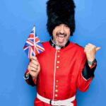 man dressed as a beefeater, laughing