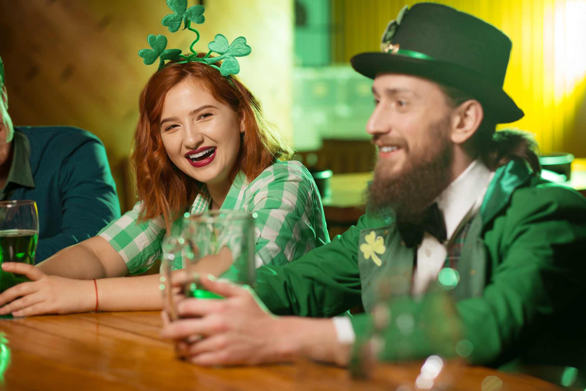 people dressed up for St Patrick's day at a bar